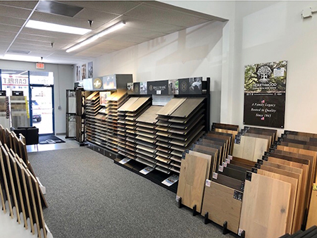 Carpet Designs Unlimited showroom with Hallmark Floors hardwood display