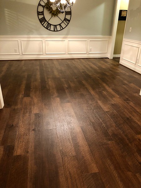 Hallmark Floors Courtier Rigid Plank living room installation by Diaz Hardwood Floors Inc
