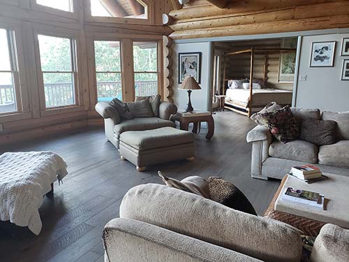 Log cabin home interior with Pekoe hardwood floors in a living room